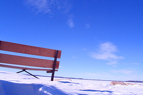 Blue Sky behind Wooden Bench