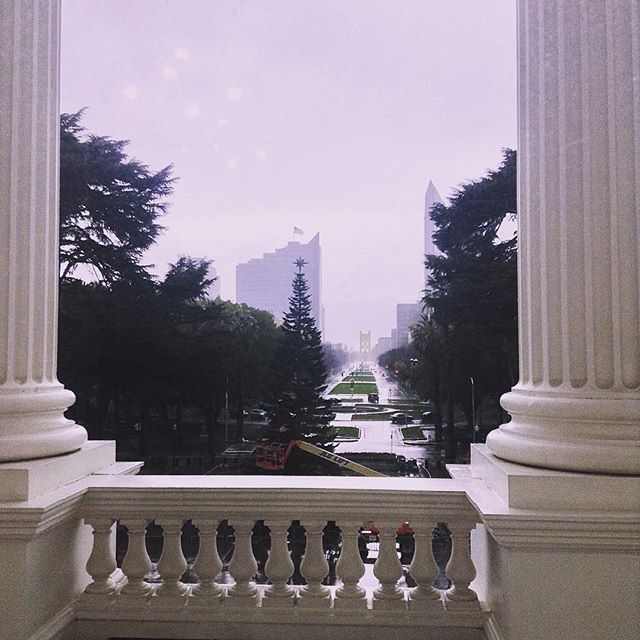 Looking down a rainy street from California State Capitol