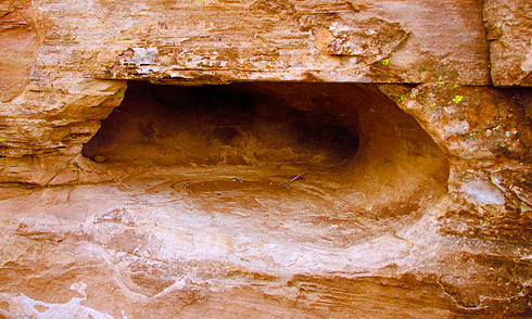 Natural cave hollowed out in sandstone