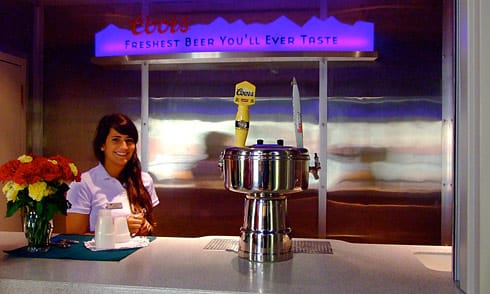 Cute Coors girl serving beer Cute Coors girl serving the freshest beer behind counter