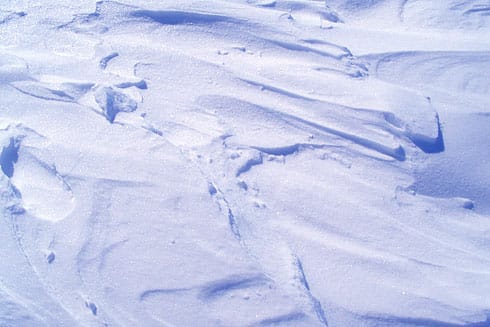 Wind-sculpted glistening snow Wind-sculpted glistening snow