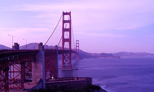 Golden Gate Bridge spanning bay with Fort Point Light below Golden Gate Bridge spanning bay with Fort Point Light below