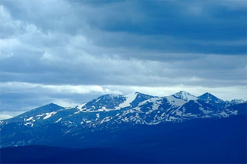 Blue Snow-covered Rocky Mountain peaks