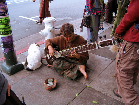 Street Performer playing sitar (busking)