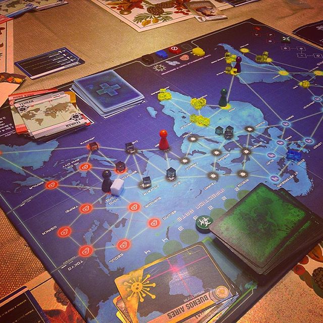 Pandemic Board game with lots of yellow disease