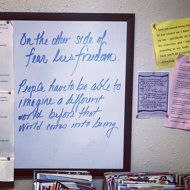 On Other Side of Fear lies Freedom quote on dry-erase board