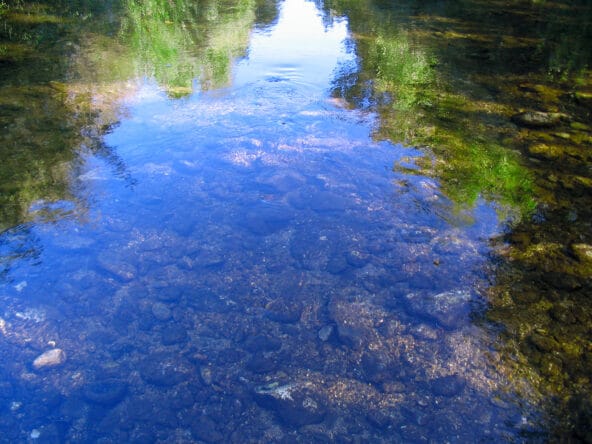 1Blue Sky reflecting in Calm Stream like a mirror