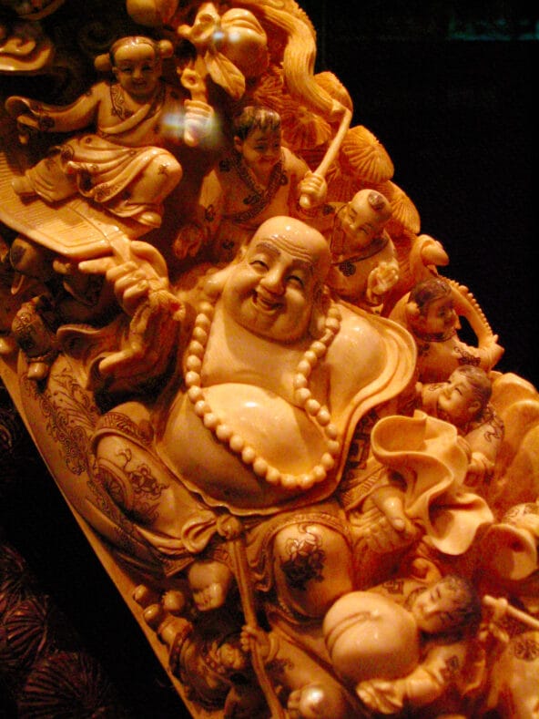 Budai (Laughing Buddha) carved into tusk