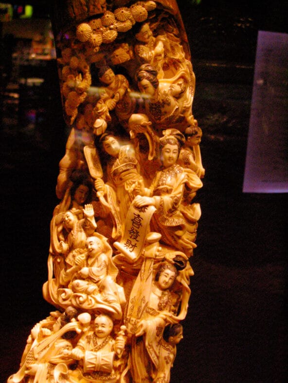Chinese people carved into tusk
