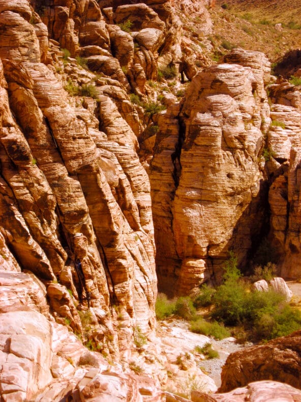 Climbers scaling very steep ancient ridge