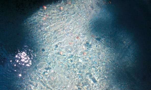 Coins in Glistening Fountain Water