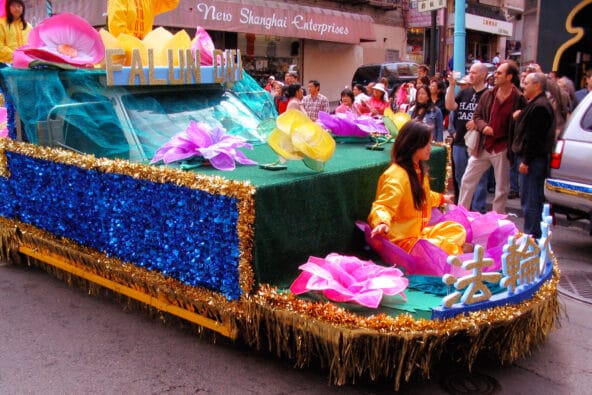 Front of Falun Dafa parade float with lotuses