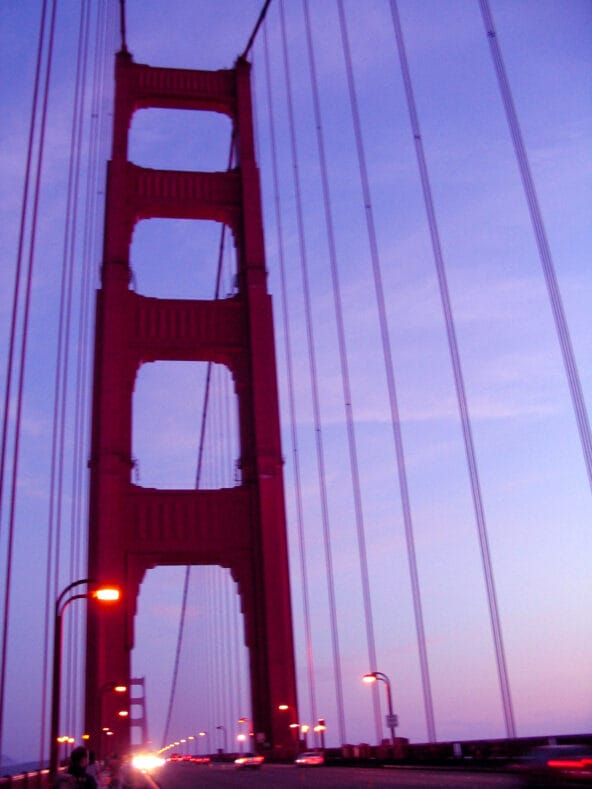 Golden Gate tower looming into dark blue sky
