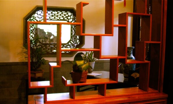 Labyrinthine wooden shelf with potted plants