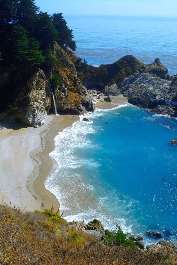 McWay Falls and a bluegreen bay below 2