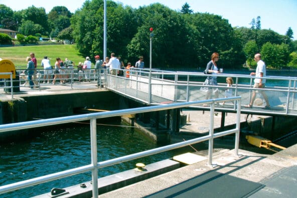People crossing over the small Chittenden lock