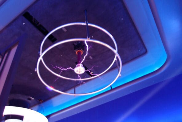 Purple bolts of Tesla Coil on ceiling