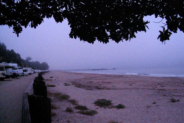 RVs parked by beach (SS Palo Alto from afar)