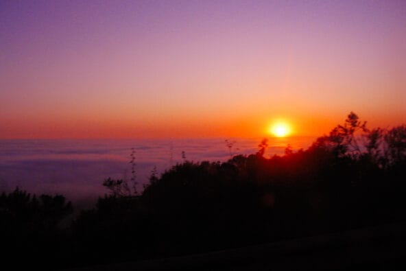 Red orange Sunset over ocean clouds
