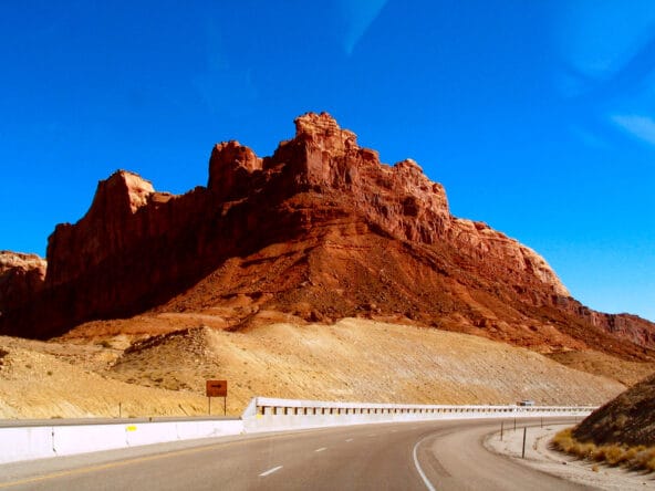 Red sandstone formation above highway