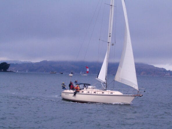 Sailboat Naniloa passes by Pier 39