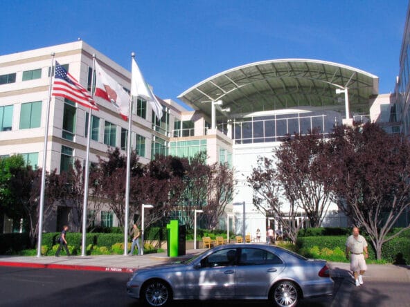 Silver Mercedes parked in front of Apple Campus bldg