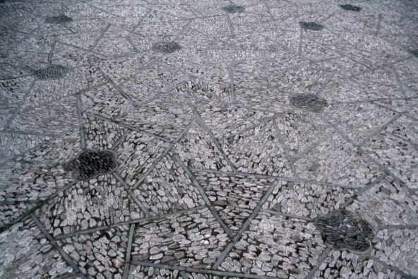 Small stones in angular floor tiles