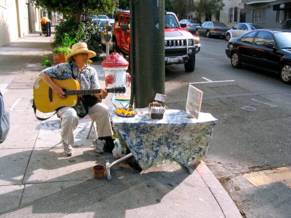 Street Performer advertising Meditation with Oranges