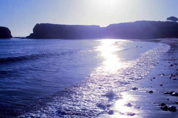 Sun reflecting off the incoming tide