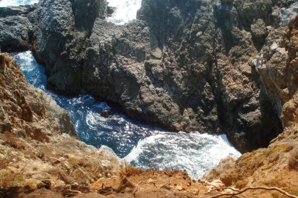 Water swirling around jagged rocks