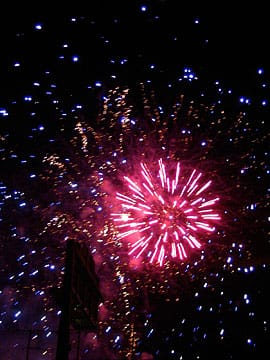Pink starburst firework over freeway