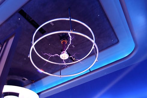Purple bolts of Tesla Coil on ceiling